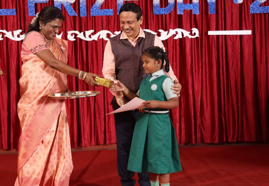 Student receiving an award on Prize Day