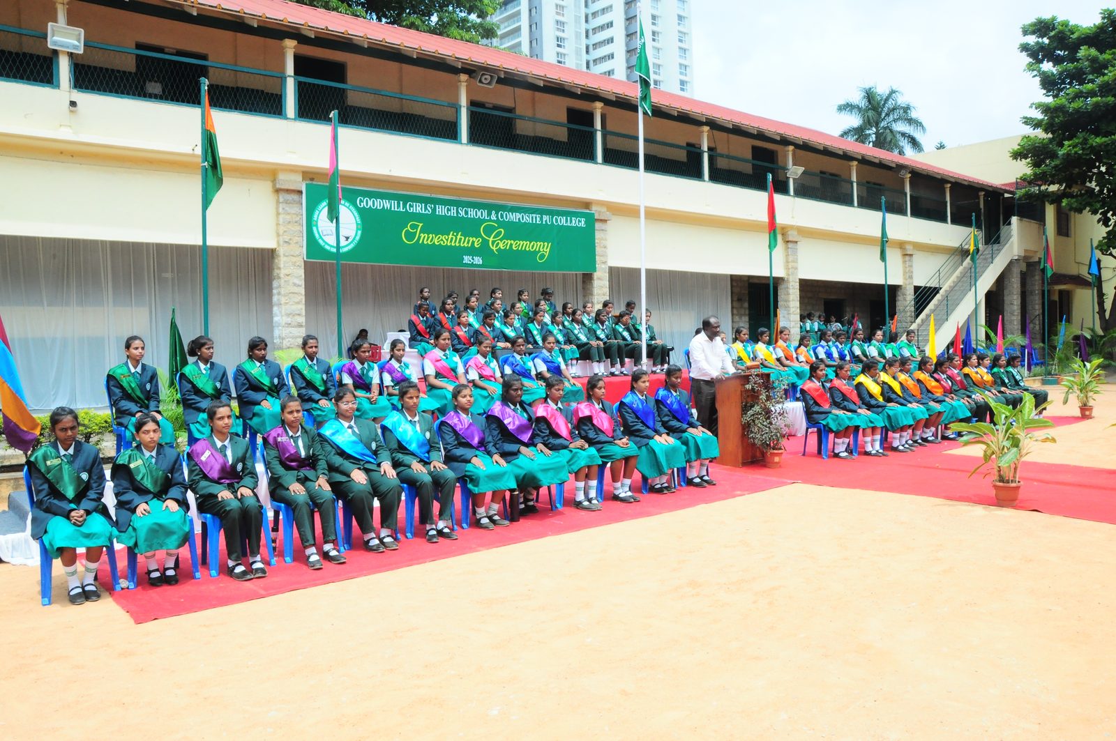 Goodwill Girls' High School students at the Investiture Ceremony, with the heritage campus building